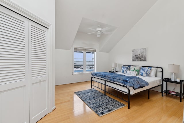 105 Chandlers Wharf Unit 105, Portland, ME 04101 - bedroom with lofted ceiling, wood finished floors, baseboards, and ceiling fan