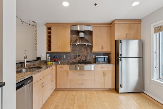105 Chandlers Wharf Unit 105, Portland, ME 04101 - kitchen featuring appliances with stainless steel finishes, light brown cabinets, wall chimney range hood, and recessed lighting