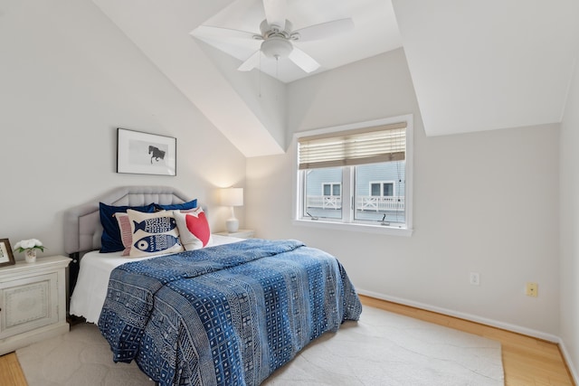 105 Chandlers Wharf Unit 105, Portland, ME 04101 - bedroom featuring wood finished floors, baseboards, ceiling fan, and lofted ceiling