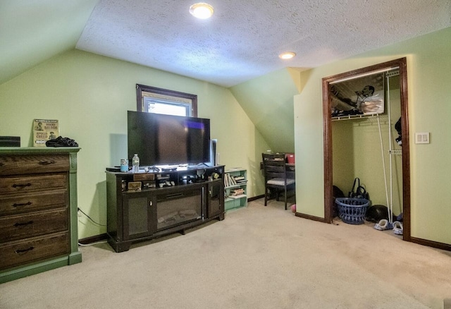 interior space with baseboards, carpet, and vaulted ceiling