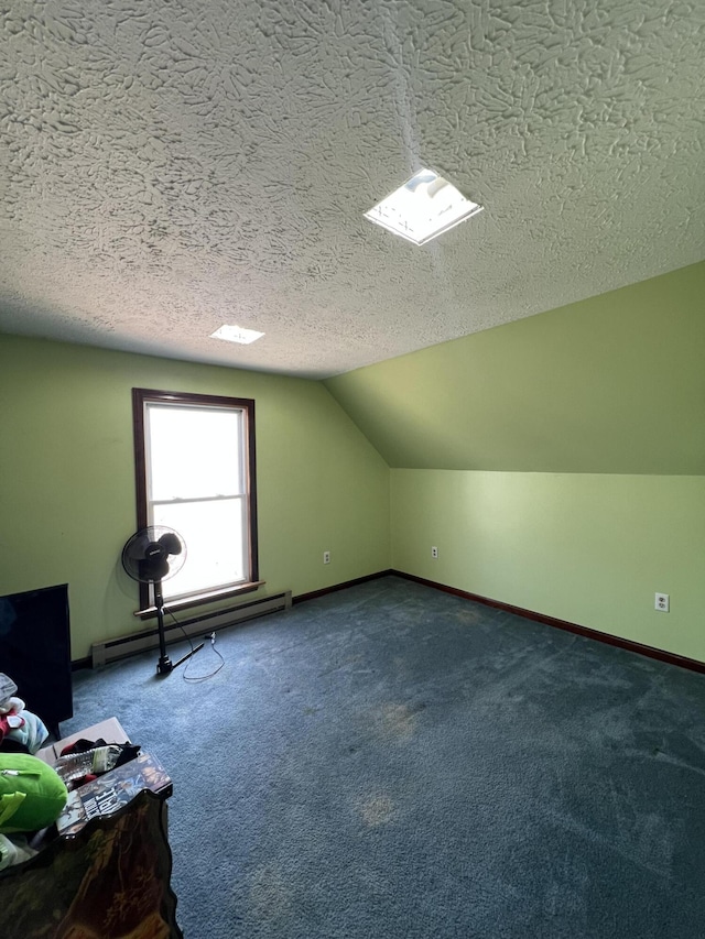 bonus room featuring a textured ceiling, carpet, baseboards, a baseboard radiator, and vaulted ceiling