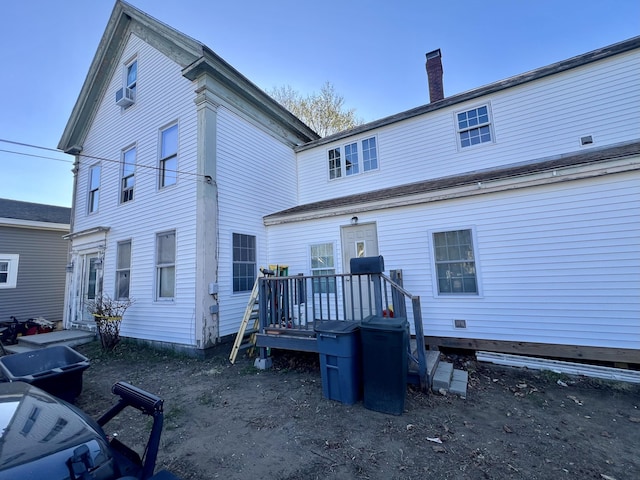 rear view of property with a chimney