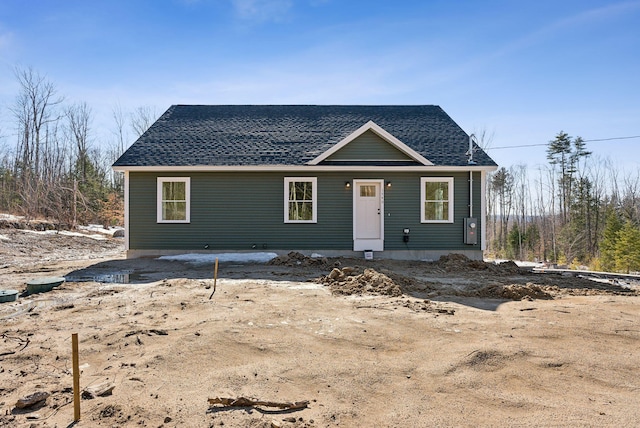 view of front of house with a shingled roof