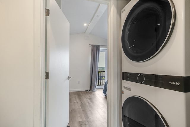 12 Romasco Ln, Portland, ME 04101 - laundry area with stacked washer / drying machine, light wood-style floors, and baseboards