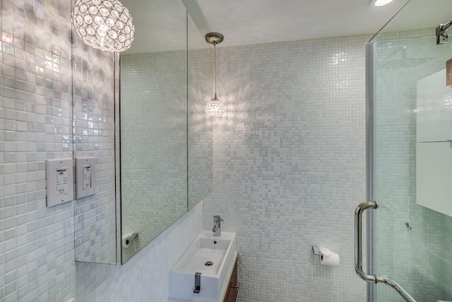 12 Romasco Ln, Portland, ME 04101 - bathroom with tile walls, an enclosed shower, and vanity