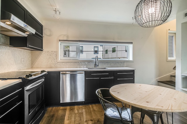 12 Romasco Ln, Portland, ME 04101 - kitchen featuring appliances with stainless steel finishes, dark cabinetry, a sink, and dark wood-type flooring
