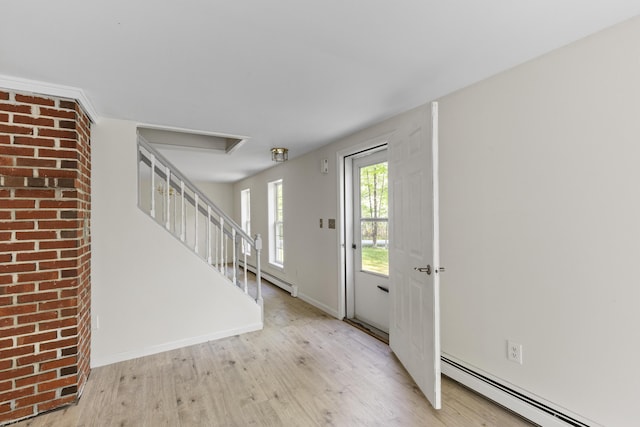 10 Trues Rd, Lincolnville, ME 04849 - foyer entrance featuring baseboard heating, wood finished floors, baseboards, and stairs