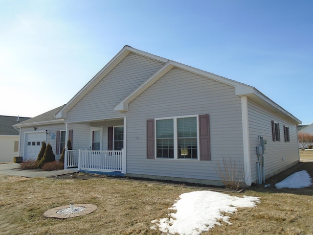 view of front of home with a porch and a garage