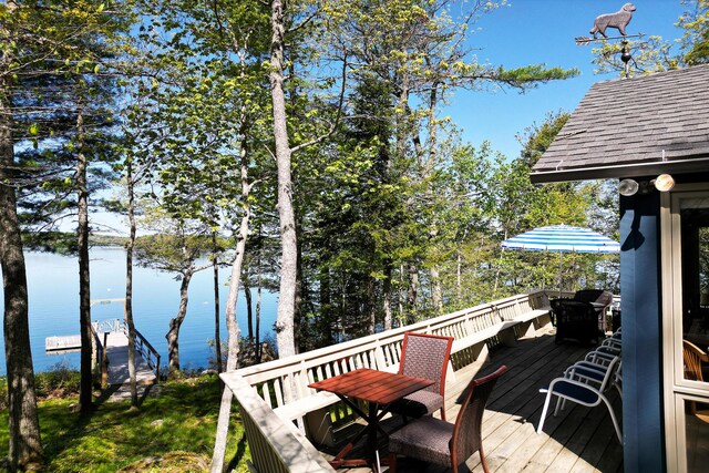 29 Good Day Dr, South Bristol, ME 04568 - wooden deck with a water view and outdoor dining space