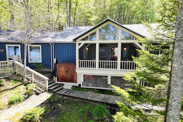 29 Good Day Dr, South Bristol, ME 04568 - view of front of home with a sunroom, board and batten siding, and a shed