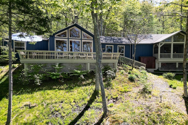 29 Good Day Dr, South Bristol, ME 04568 - rear view of house with a deck and a sunroom