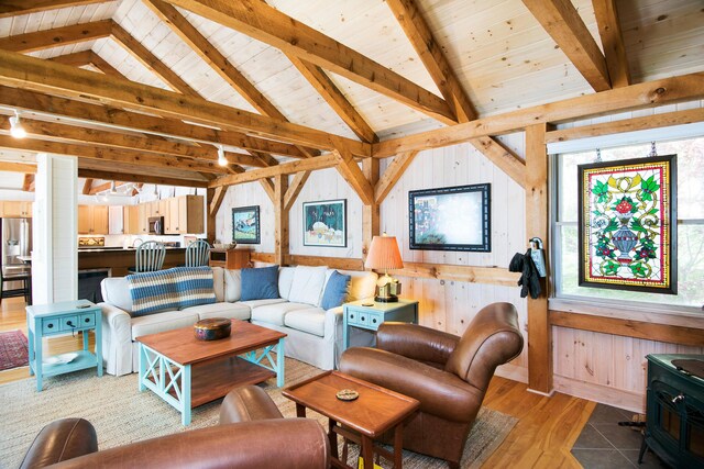 29 Good Day Dr, South Bristol, ME 04568 - living area featuring a wood stove, light wood-style floors, wood ceiling, and wood walls