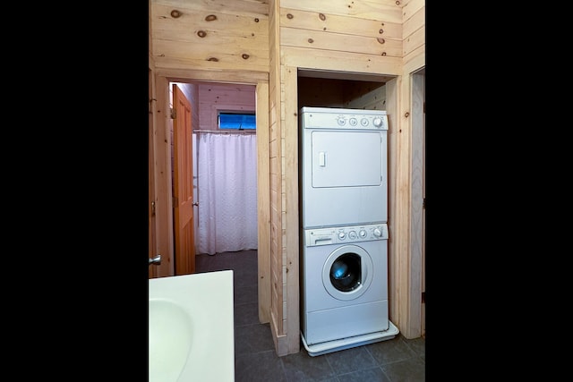 29 Good Day Dr, South Bristol, ME 04568 - laundry area with stacked washing machine and dryer and dark tile patterned floors