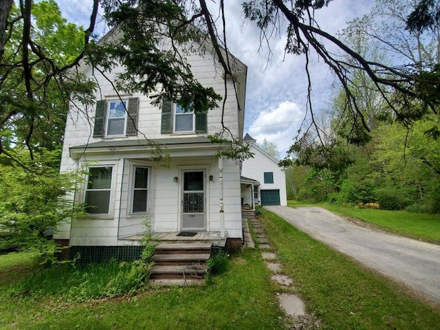 view of front of house with a garage and aphalt driveway
