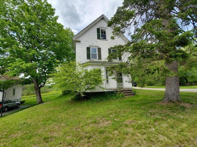 view of front of home with a front yard