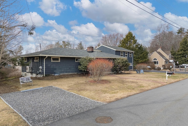 11 Elm Dr, York, ME 03909 - view of side of property with a yard, a shingled roof, and a chimney