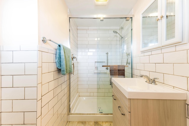 11 Elm Dr, York, ME 03909 - bathroom with a stall shower, vanity, and tile walls