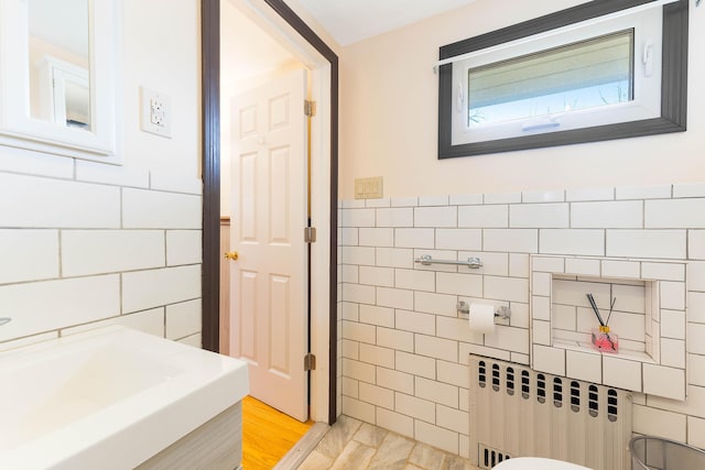 11 Elm Dr, York, ME 03909 - bathroom with tile walls and radiator