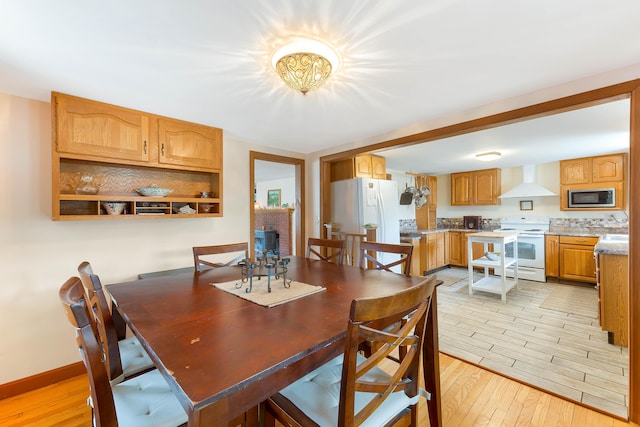 11 Elm Dr, York, ME 03909 - dining room featuring light wood-style floors and baseboards