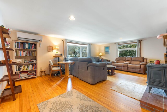 11 Elm Dr, York, ME 03909 - living room featuring a wall mounted AC, plenty of natural light, and hardwood / wood-style flooring
