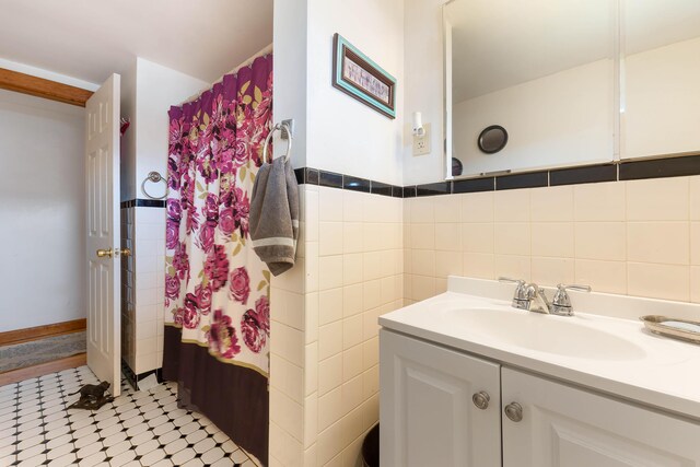 11 Elm Dr, York, ME 03909 - bathroom featuring tile walls and vanity