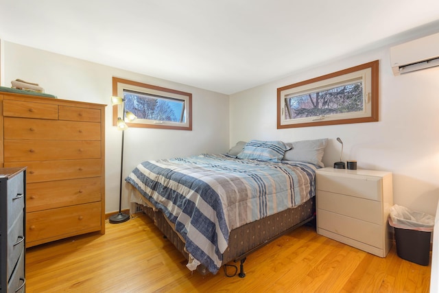 11 Elm Dr, York, ME 03909 - bedroom featuring light wood-style flooring and an AC wall unit