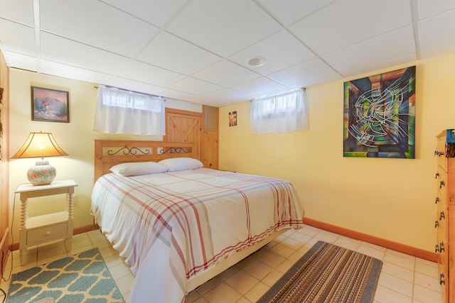 11 Elm Dr, York, ME 03909 - bedroom with light tile patterned floors, baseboards, and a drop ceiling