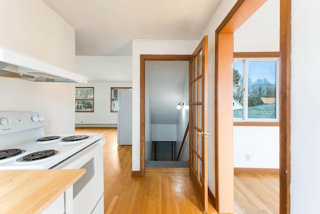 11 Elm Dr, York, ME 03909 - kitchen with baseboards, white appliances, white cabinetry, light wood finished floors, and range hood