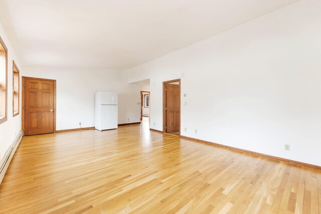 11 Elm Dr, York, ME 03909 - unfurnished room featuring baseboards, light wood-type flooring, and baseboard heating