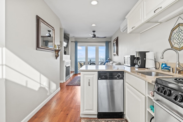 kitchen with white cabinets, appliances with stainless steel finishes, and a sink