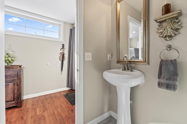 bathroom featuring baseboards and wood finished floors