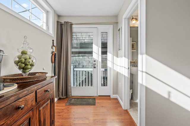 doorway featuring light wood finished floors