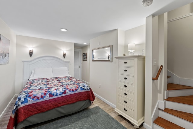 bedroom featuring recessed lighting, baseboards, and light wood-type flooring