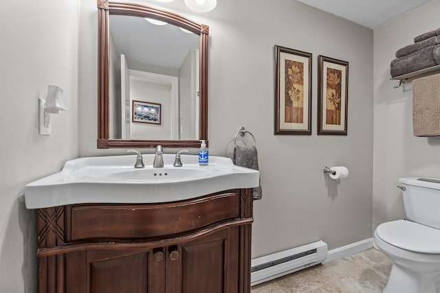 bathroom with a baseboard heating unit, baseboards, toilet, and vanity