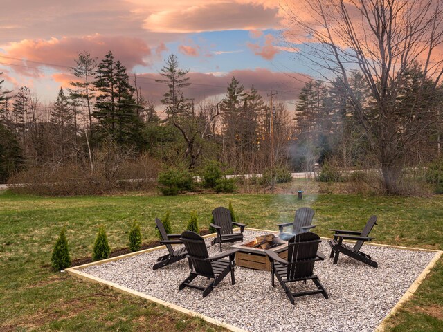 view of yard with a patio and a fire pit