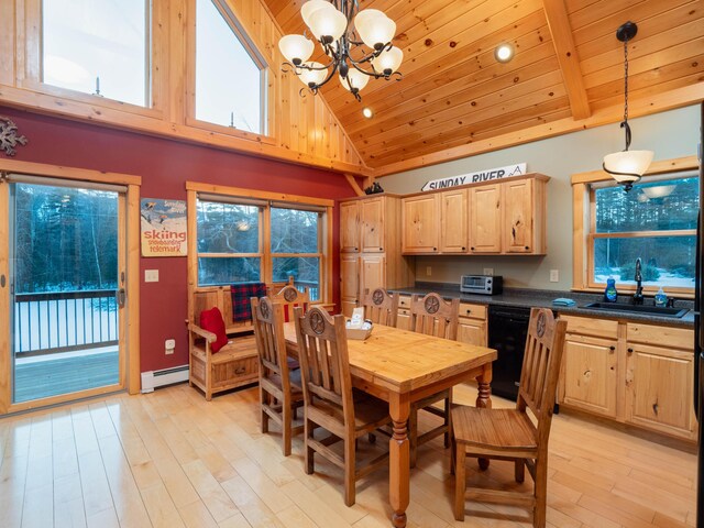 dining space featuring a notable chandelier, light wood-style flooring, wood ceiling, and a baseboard heating unit