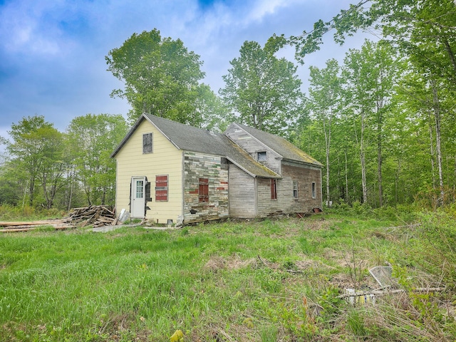 211 Pleasant River Rd, Milo, ME 04463 - view of front facade featuring stone siding