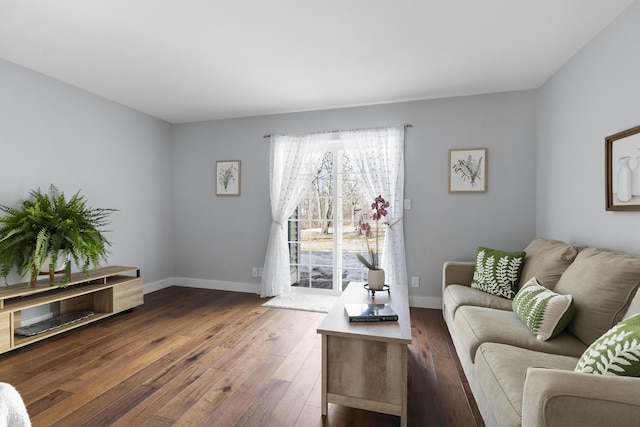 living room with baseboards and hardwood / wood-style flooring