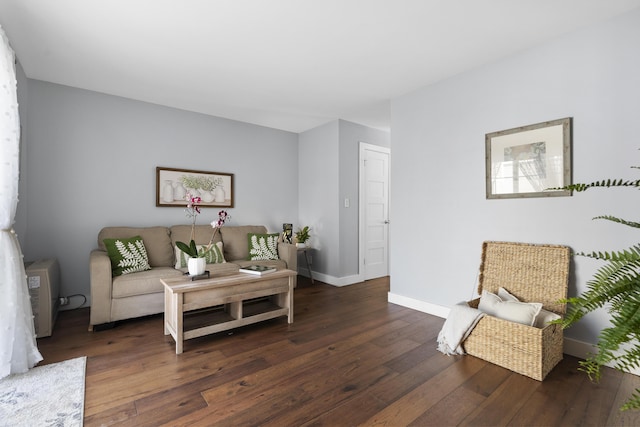 living area with hardwood / wood-style flooring and baseboards