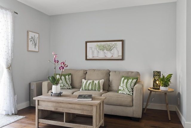 living area featuring wood finished floors and baseboards