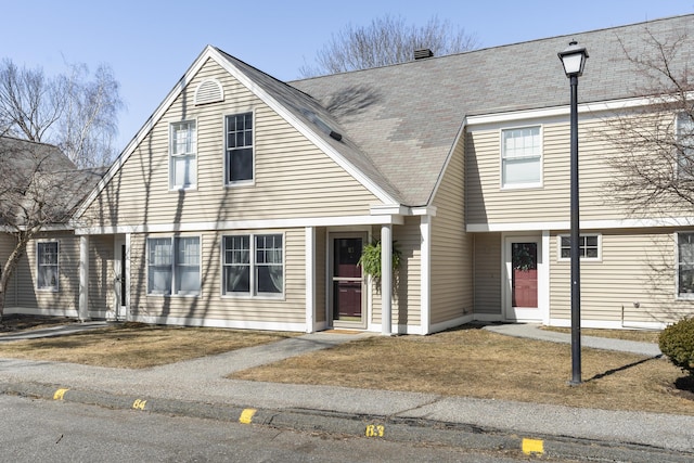 view of front of house featuring roof with shingles