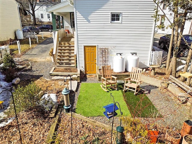 rear view of house featuring stairway