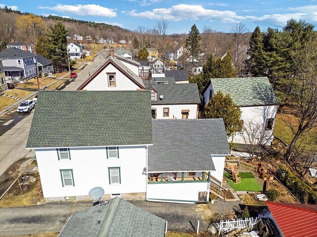 birds eye view of property with a residential view