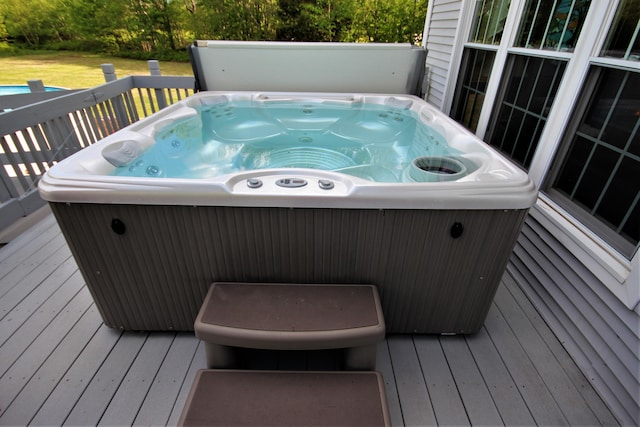 wooden terrace with a hot tub