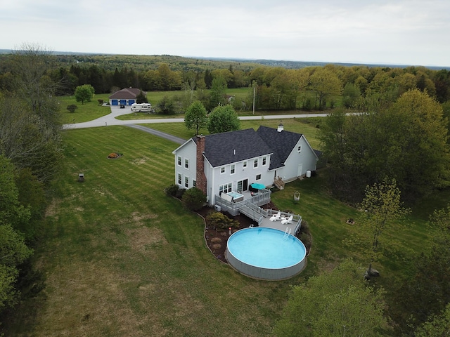 birds eye view of property featuring a rural view and a view of trees