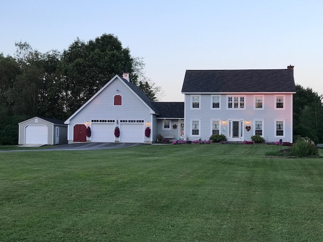 colonial inspired home with a front lawn and a chimney