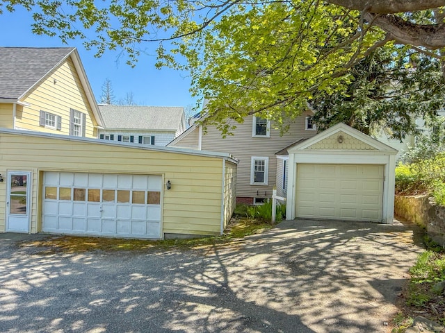 39 Washington St, Rumford, ME 04276 - traditional home featuring a garage and an outdoor structure