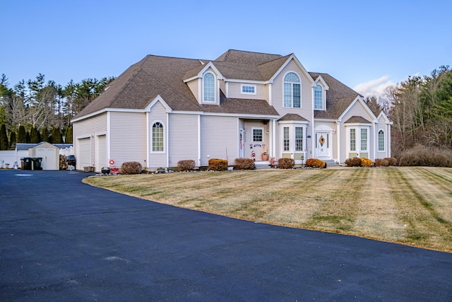 16 Ocean Greens Dr, Saco, ME 04072 - view of front of property featuring aphalt driveway, a garage, a front lawn, and roof with shingles