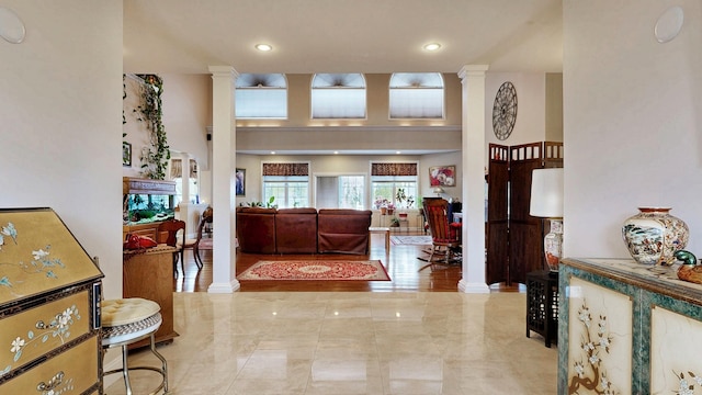16 Ocean Greens Dr, Saco, ME 04072 - entrance foyer with baseboards, a towering ceiling, recessed lighting, and ornate columns