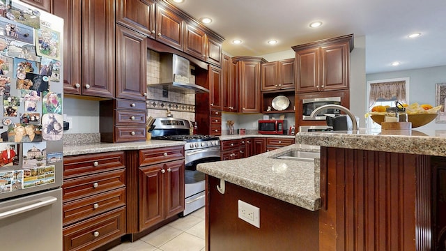 16 Ocean Greens Dr, Saco, ME 04072 - kitchen with light tile patterned flooring, a sink, wall chimney exhaust hood, appliances with stainless steel finishes, and recessed lighting